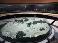 Model terenu przedstawiający bitwę pod Racławicami. Na tle miniatury żołnierzyków w historycznych strojach.