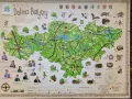 Mapa Doliny Baryczy, ukazująca atrakcje przyrodnicze i kulturowe, w tym stawy, lasy, zabytki i lokalne potrawy.
